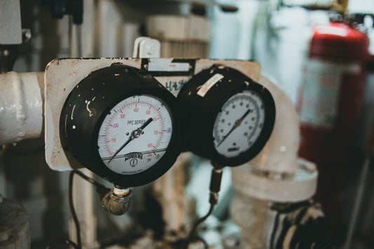 a couple of gauges that are on a wall