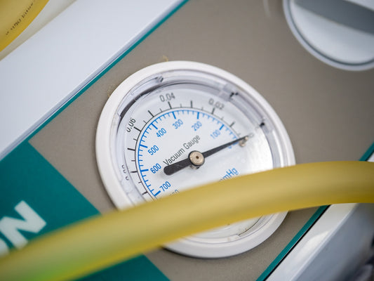 A close up of a thermometer and a hose