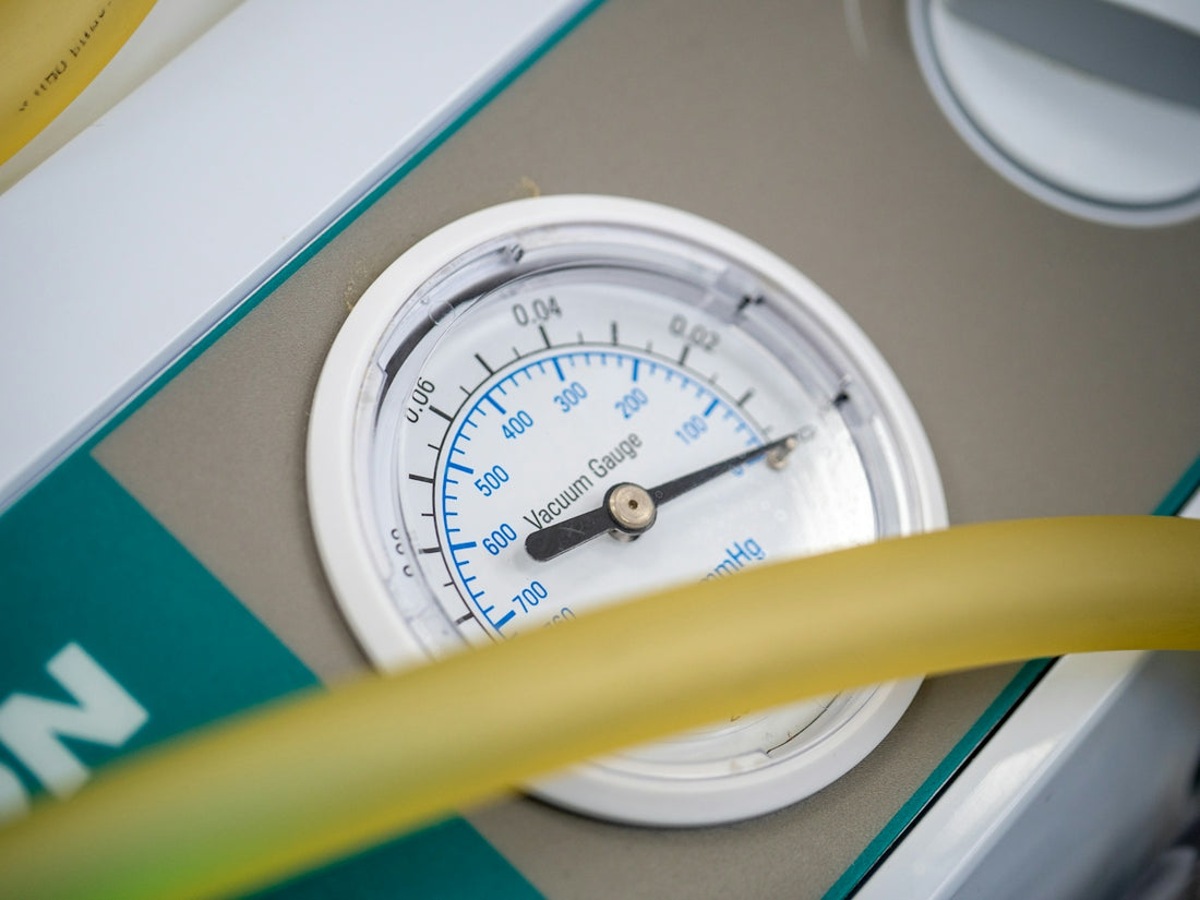 A close up of a thermometer and a hose